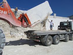 Hitachi ZW550 loading marble truck