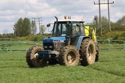 Ford 8340 SLE spraying spring barley